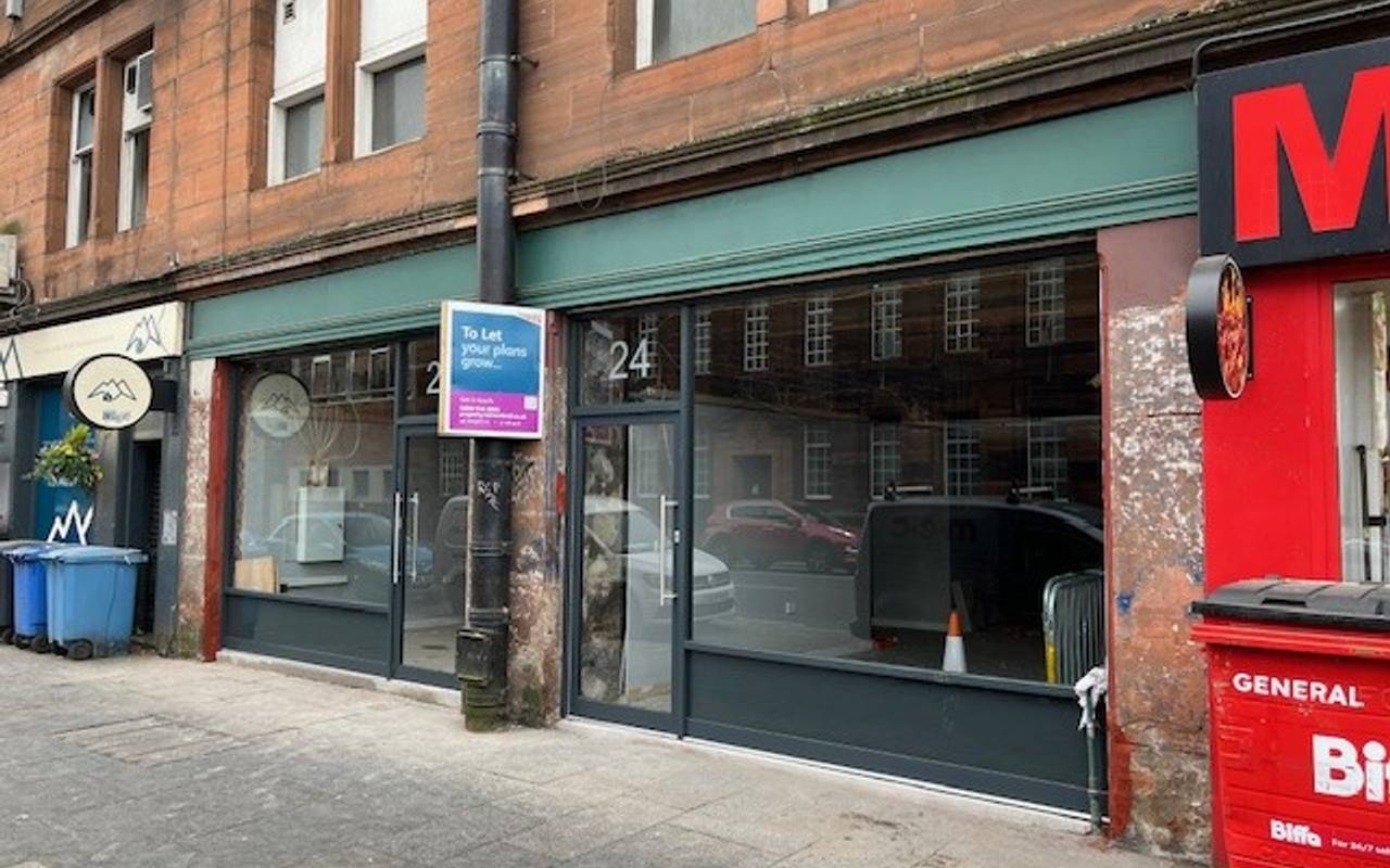 Small office space to let in central location with modern glass storefront at 24 High Street.