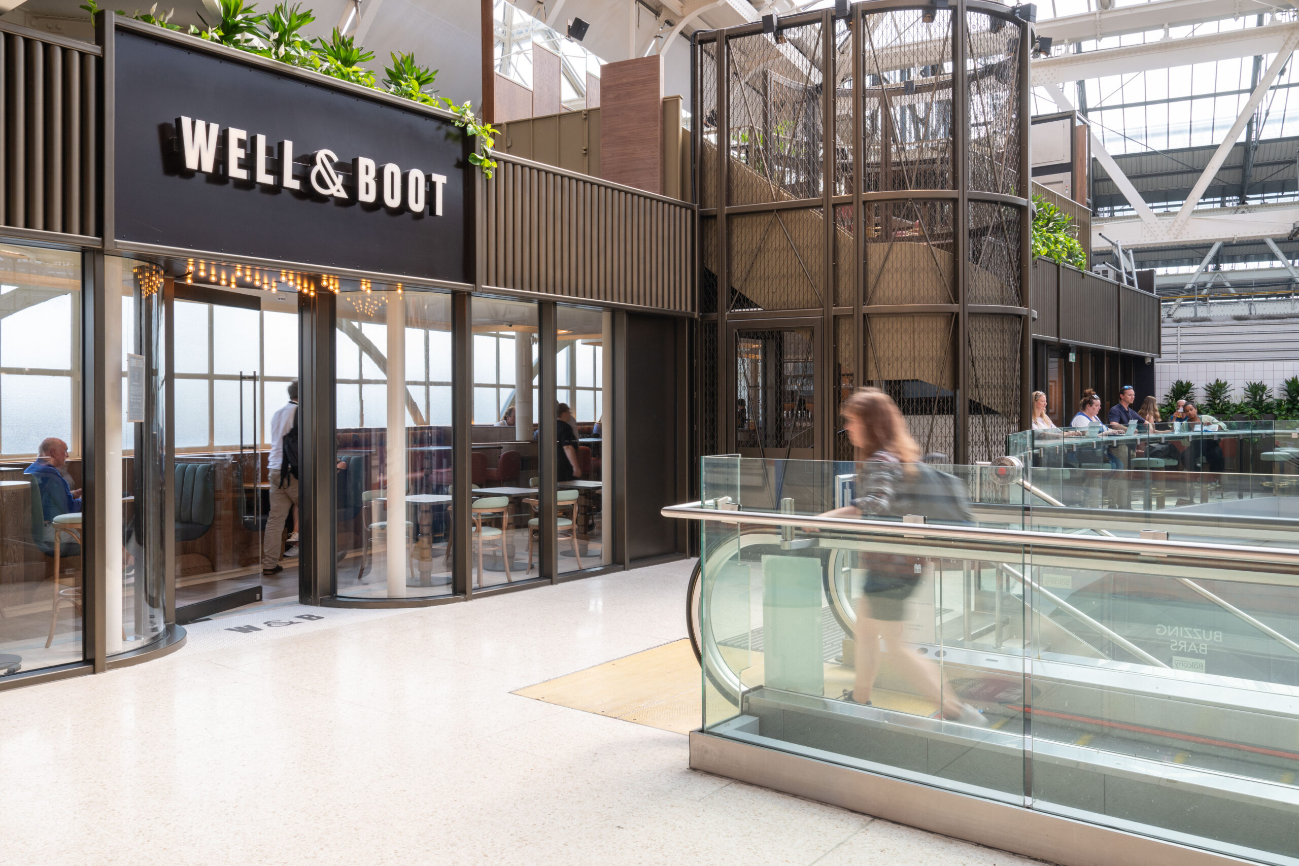 Exterior view of Well & Boot inside major UK station.